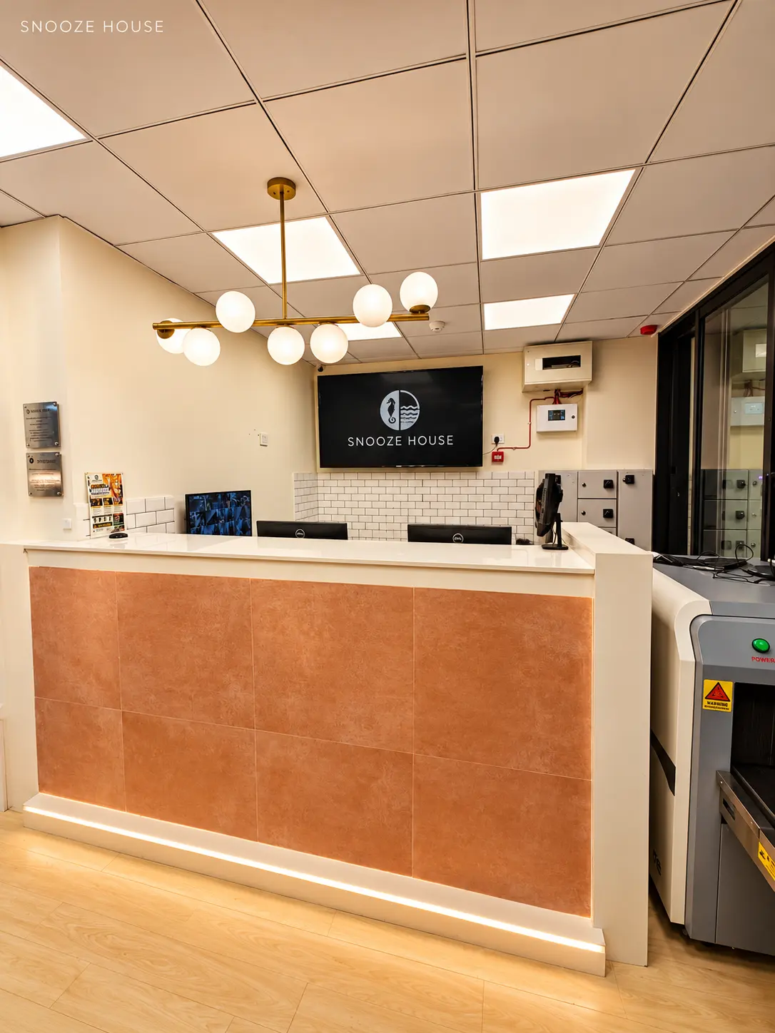 Reception desk with brass globe lights